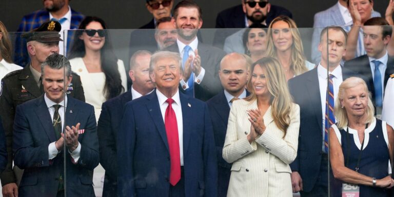 Trump watches as military parade starts early despite rain, ignores ‘No Kings’ protests.