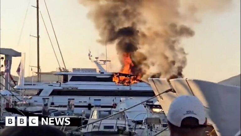 Luxury yacht in St Tropez engulfed in flames, smoke fills the air