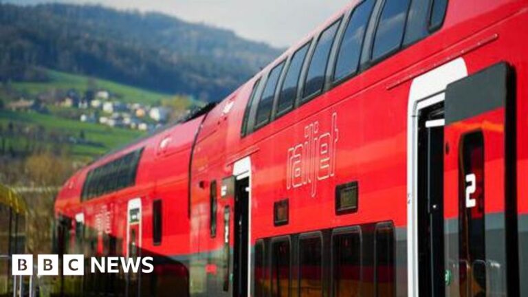Man leaps onto speeding train