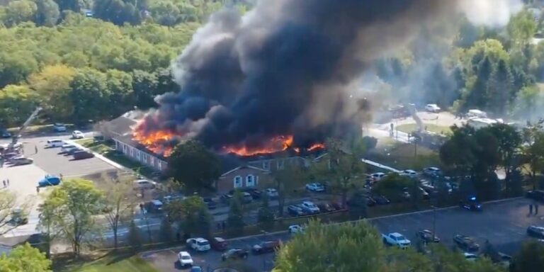 At least 4 killed and 8 injured as gunman in truck crashes into Michigan church and opens fire