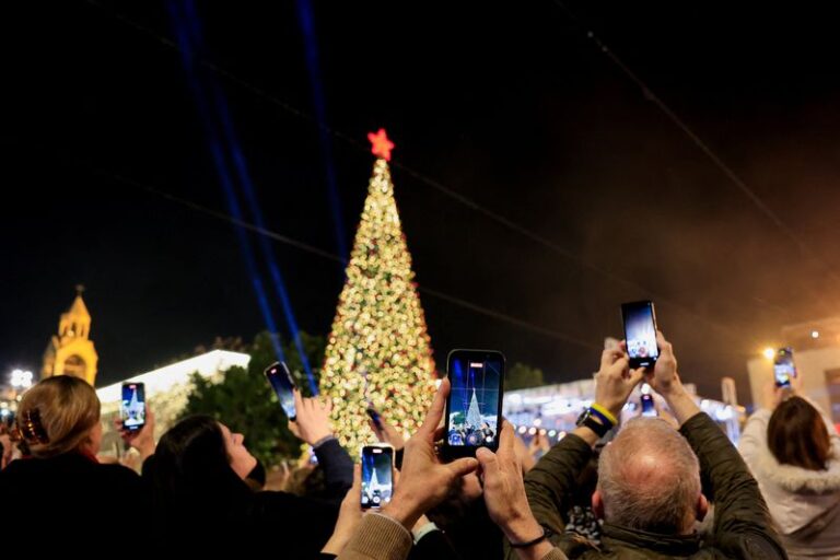 Palestinians in Bethlehem seek hope as Christmas lights illuminate the city