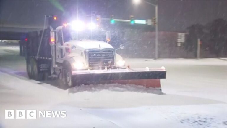 Snow ploughs brave blizzards to clear roads and runways in Oklahoma